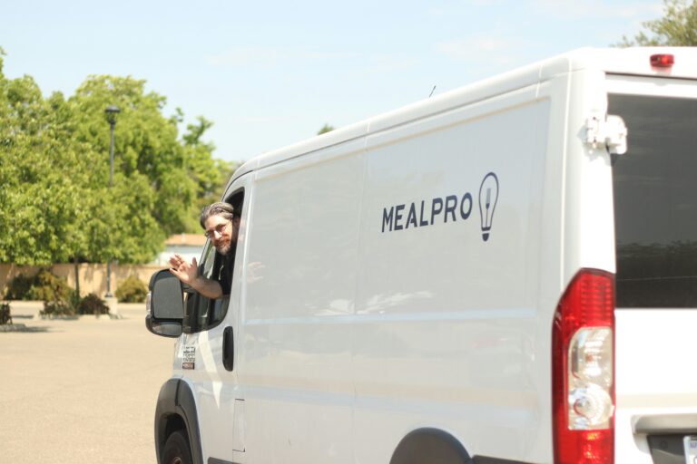 auto glass replacement van driving away